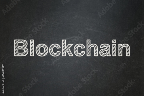 Currency concept: text Blockchain on Black chalkboard background