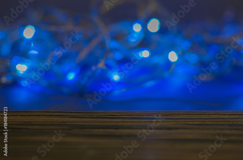 Bright bokeh lights. The flashy blue is the background to the wo