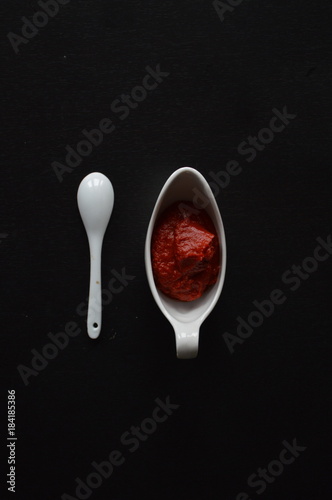 Red Tomato Sauce, White Pot and White Spoon