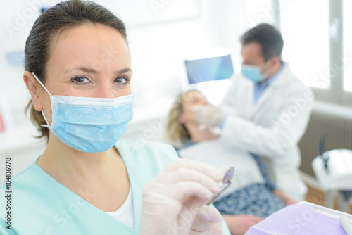 portrait of female dentist smiling in dental clinic