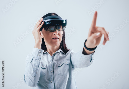 Woman wearing augmented reality goggles.
