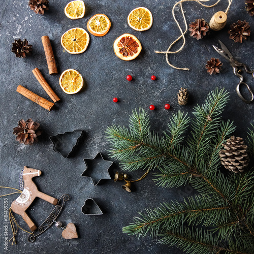 Christmas flat lay home decor, dry oranges, fir tree, cinnamon and cones