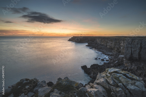 Stunning vibrant landscape image of cliffs around St Govan's Head on Pembrokeshire Coast in Wales