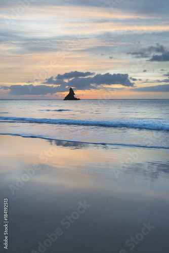 Beautiful sunrise landsdcape of idyllic Broadhaven Bay beach on Pembrokeshire Coast in Wales photo