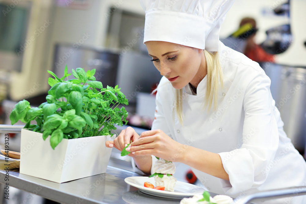 Busy chef at work in the restaurant kitchen Busy chef at work in the restaurant kitchen