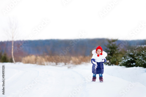 Father and daughter at snowy park.