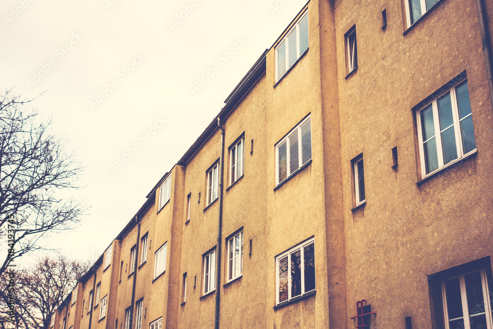 Naklejka premium old gdr building with orange facade