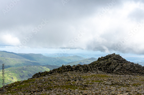 Clouds and rocks on Scafell Pike, England's tallest mountain, in the Lake District, Cumbria. photo