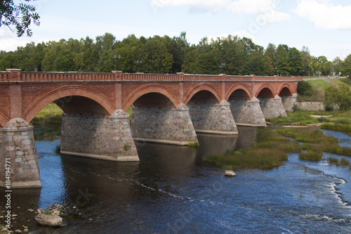 old Brick bridge across the River Venta in the city of Kuldiga Latvia © Ingus Evertovskis