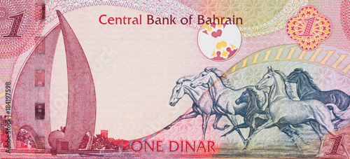 Galloping Arabian Horses and the Sail and Pearl monument on Bahrain one dinar (2006) banknote closeup macro, Bahraini money close up. photo