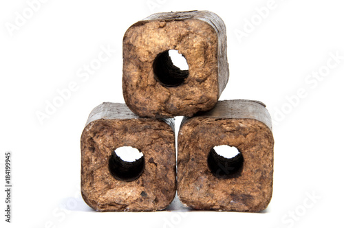 фотографія Renewable wooden briquettes for heating Alternative fuel eco fuel bio fuel
