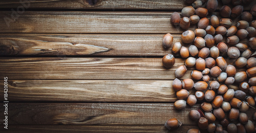 Nuts on a wooden background. Useful autumn food.