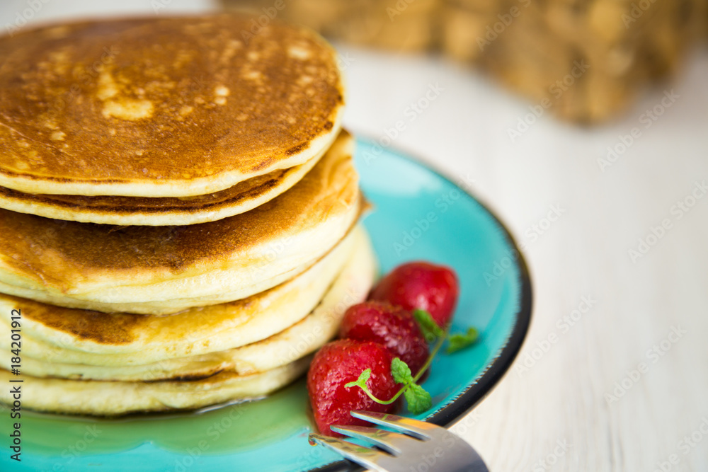 Close up breakfast pancakes with strawberries and mint Close up breakfast pancakes with strawberries and mint
