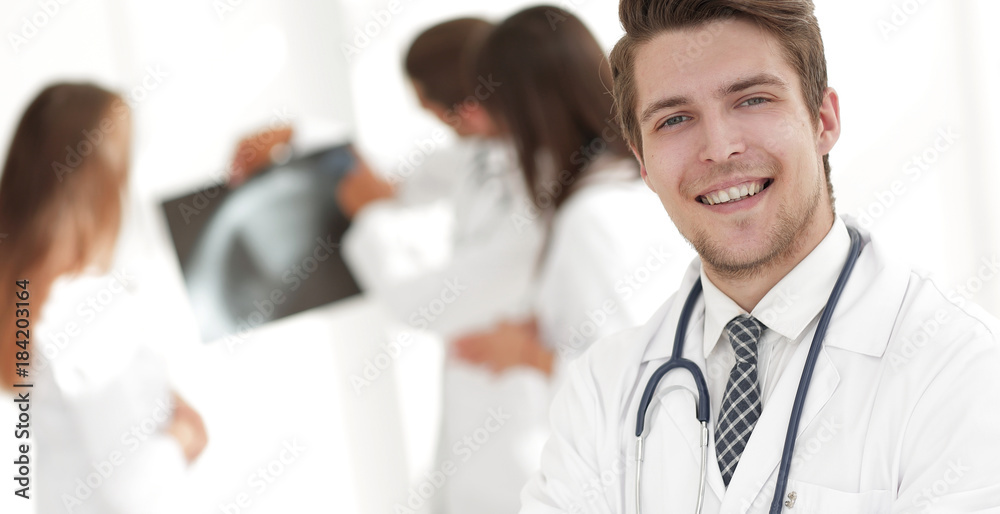 Fototapeta premium young doctor on the background of colleagues