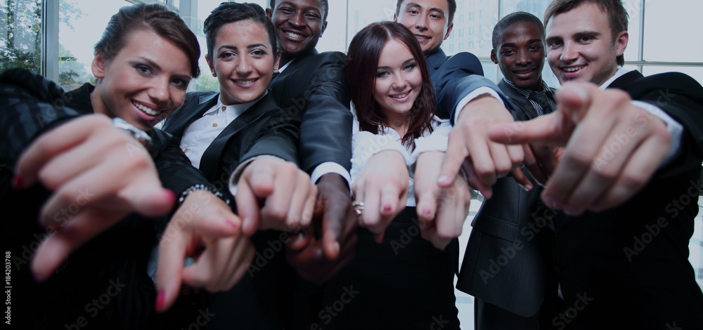 Large group of multiethnic business people pointing their finger Large group of multiethnic business people pointing their finger