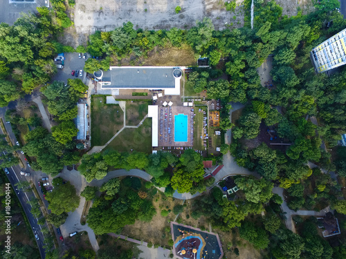 Swimming pool aerial drone view in the city