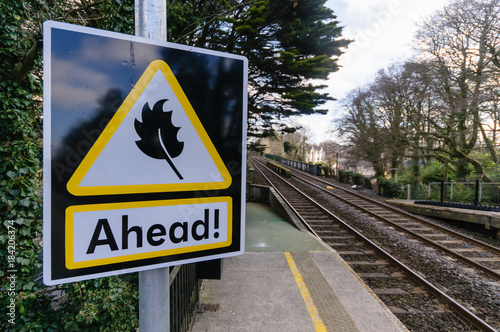 Sign warning train drivers that leaves may be on the railway line