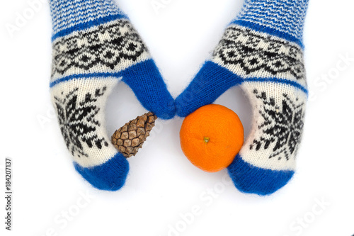 Christmas mittens are isolated on a white background. © Andrii