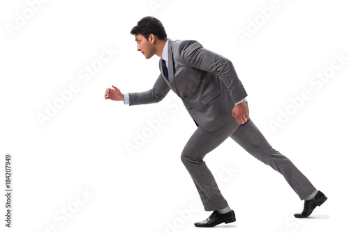 Young businessman running forward isolated on white © Elnur