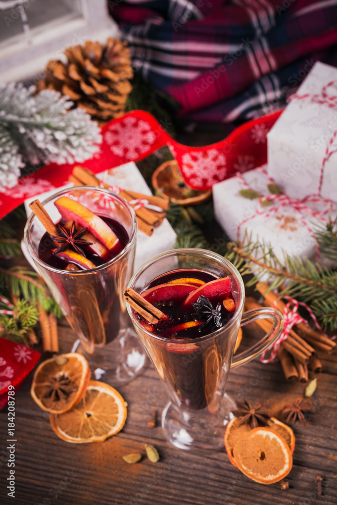 Mulled wine with fruits, cinnamon sticks, anise and decorations Mulled wine with fruits, cinnamon sticks, anise and decorations