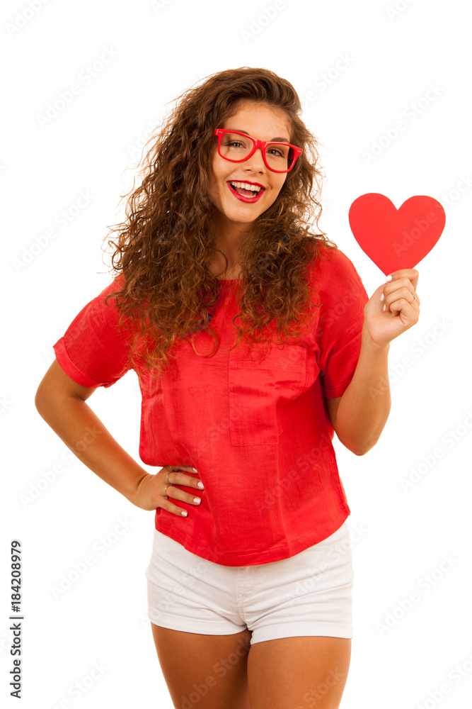 Beautiful young woman in red holding a heart for valentines day isolated over white background Beautiful young woman in red holding a heart for valentines day isolated over white background