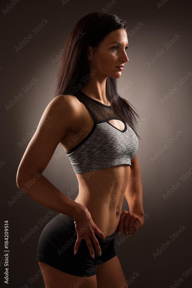 Beautiful young hispanic fit sporty woman studio portrait Beautiful young hispanic fit sporty woman studio portrait