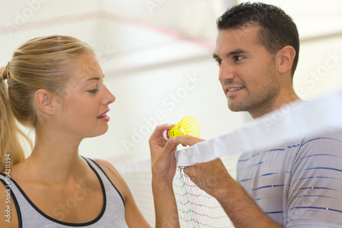 young couple playing badminton
