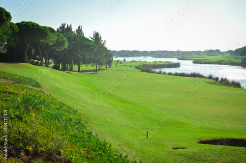 Sunny day and golf field natural scenic outdoors  bright sky background. Sunshine fitness leisure lifestyle space