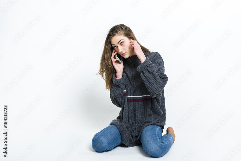 Young girl with a phone in hand Young girl with a phone in hand