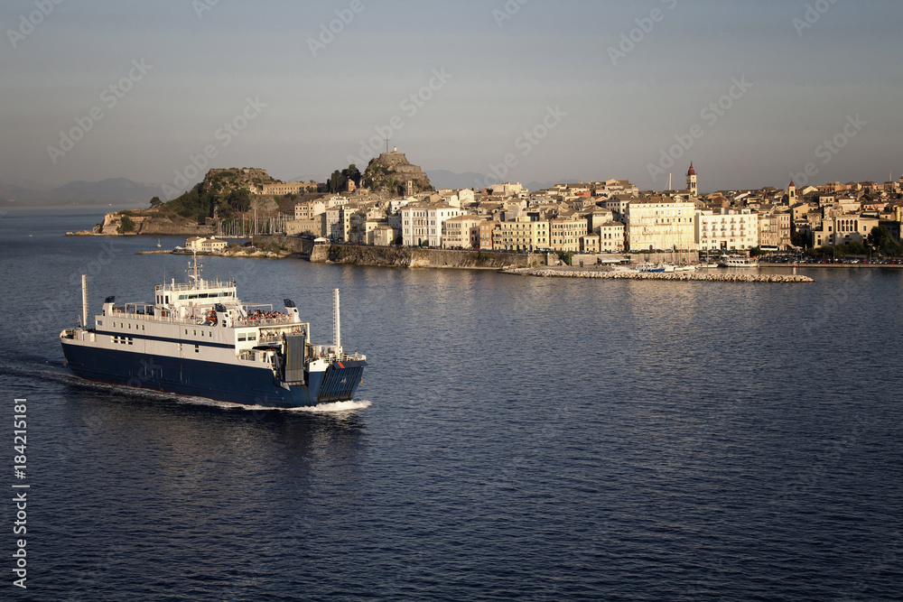 Aerial view of Corfu city (Greek Island) and a ferry boat leaving.