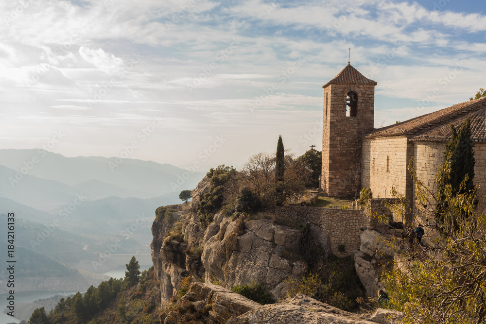 Beautiful medieval surreal castle on the highest peak of a European mountain and half the wild nature Beautiful medieval surreal castle on the highest peak of a European mountain and half the wild nature