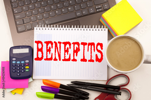 Word writing Benefits in the office with laptop, marker, pen, stationery, coffee. Business concept for Bonus Employee Financial Benefits Workshop white background with copy space