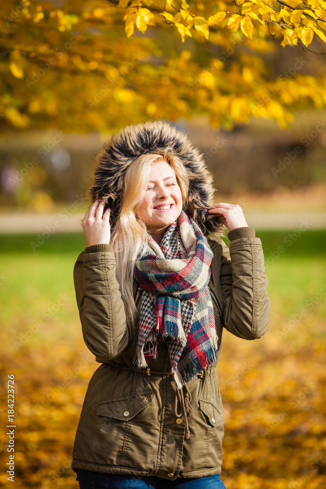 Woman walking in park during autumn Woman walking in park during autumn