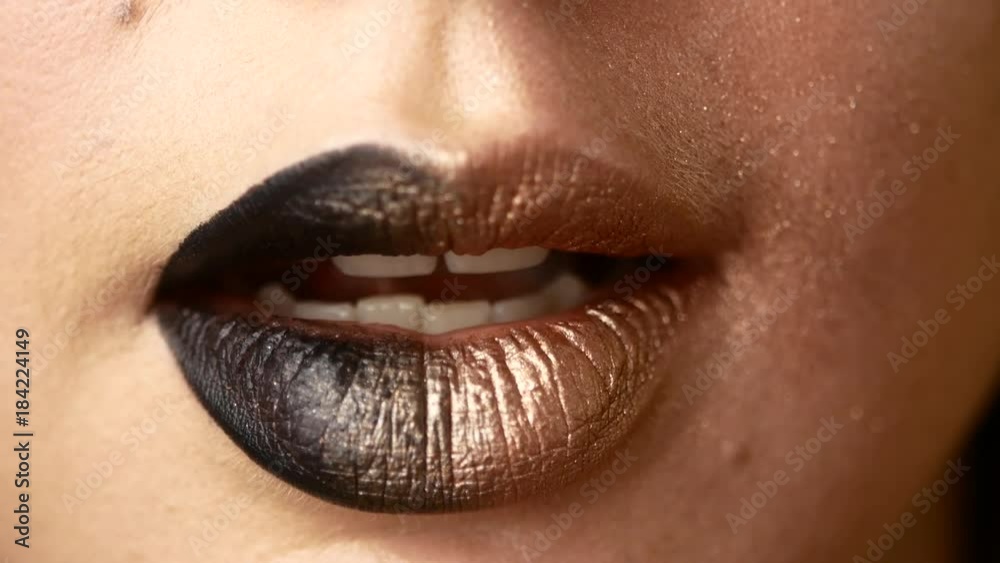 Beautiful and sexy female lips with expensive makeup. Close-up of painted female lips Beautiful and sexy female lips with expensive makeup. Close-up of painted female lips