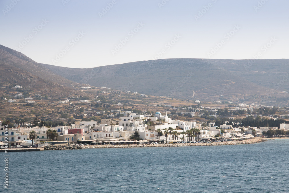 View over a bay with a typical village on Paros, one of the Cyclade islands in Greece
