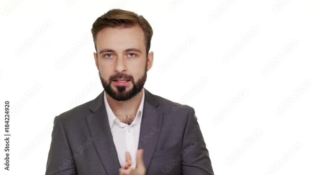 Portrait of nervous male person 30s trying to concentrate tune into serious conversation rubbing his hands being freaking out over white background. Concept of emotions Portrait of nervous male person 30s trying to concentrate tune into serious conversation rubbing his hands being freaking out over white background. Concept of emotions