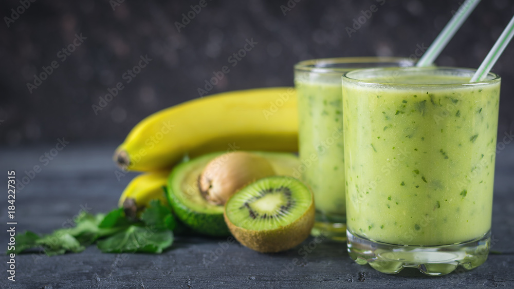 Smoothies from avocados, bananas, kiwi and herbs on a wooden table. Diet vegetarian food. Smoothies from avocados, bananas, kiwi and herbs on a wooden table. Diet vegetarian food.