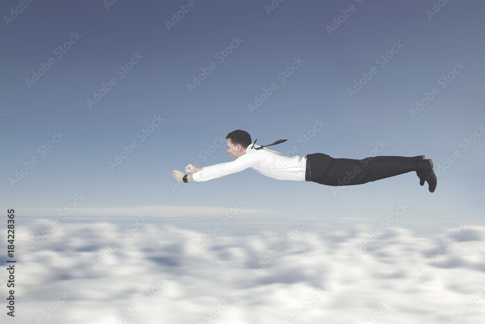 European businessman flying in the sky