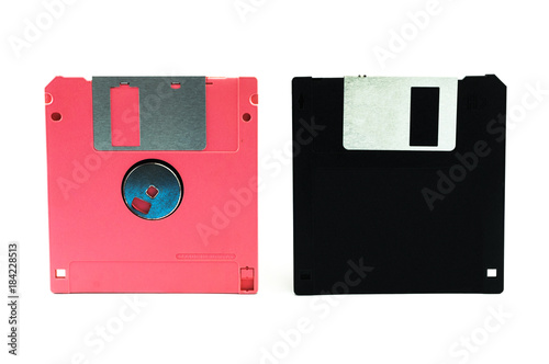 Black and pink floppy disks isolated on white background.