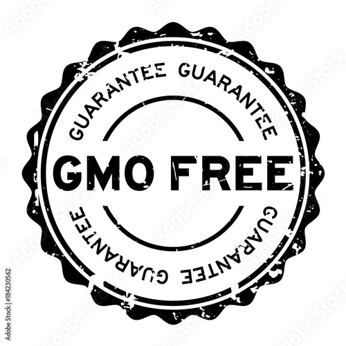 Grunge black GMO free guarantee word round rubber seal stamp on white background