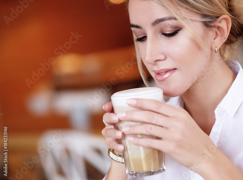 lifestyle and people concept  Beautiful Girl With Cup of Coffee