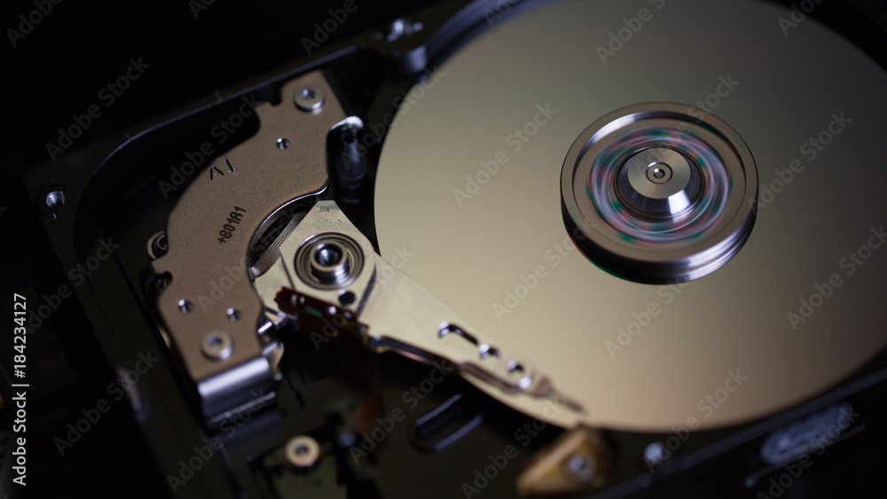 Disassembled hard drive from the computer, hdd with mirror effect Opened hard drive from the computer hdd with mirror effects Part of computer pc. Disassembled hard drive from the computer, hdd with mirror effect Opened hard drive from the computer hdd with mirror effects Part of computer pc.