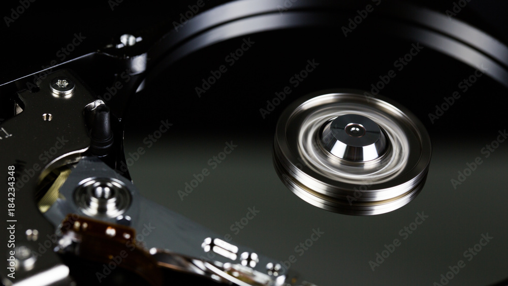 Disassembled hard drive from the computer, hdd with mirror effect Opened hard drive from the computer hdd with mirror effects Part of computer pc. Disassembled hard drive from the computer, hdd with mirror effect Opened hard drive from the computer hdd with mirror effects Part of computer pc.