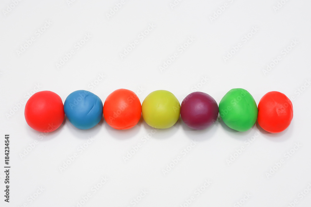 colorful playdough close up image on white background. colorful playdough close up image on white background.