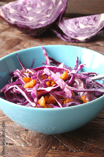 Salad of red cabbage, pieces of grilled chicken, sweet peppers, avocado, tomato