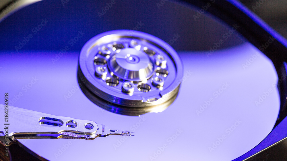 Disassembled hard drive from the computer, hdd with mirror effect Opened hard drive from the computer hdd with mirror effects Part of computer pc. Disassembled hard drive from the computer, hdd with mirror effect Opened hard drive from the computer hdd with mirror effects Part of computer pc.