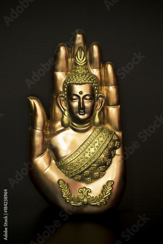 Canvas Print Buddha in hand on black background