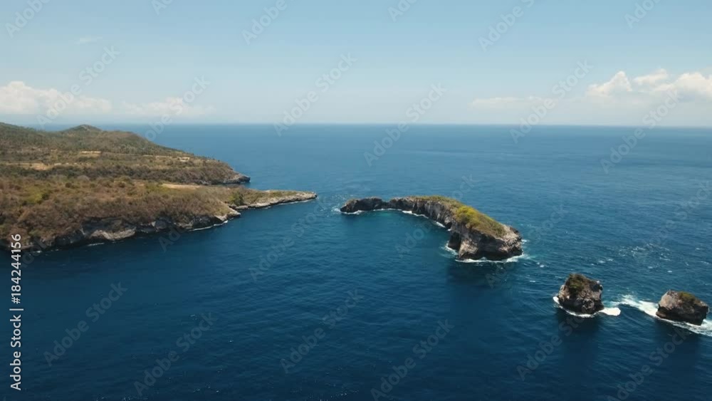 Seascape, rocky coast, beach, ocean, blue sea, waves, Nusa Penida, Indonesia. Aerial view Ocean with waves and rock. 4K video. Travel concept Aerial footage Seascape, rocky coast, beach, ocean, blue sea, waves, Nusa Penida, Indonesia. Aerial view Ocean with waves and rock. 4K video. Travel concept Aerial footage