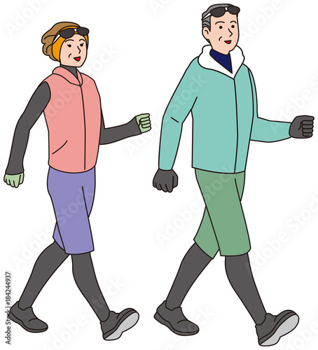 冬の服装でにウオーキングする中年夫婦