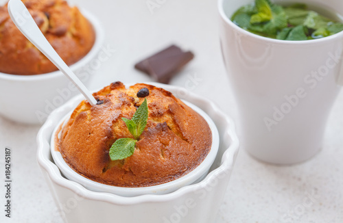 Chocolate capkake with mint tea photo